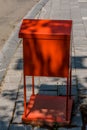 Orange local newspaper rack