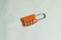 Orange lock for bags with code Royalty Free Stock Photo