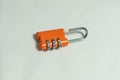 Orange lock for bags with code Royalty Free Stock Photo