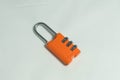 Orange lock for bags with code Royalty Free Stock Photo