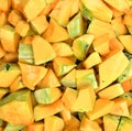Orange long pumpkin cut into pieces Royalty Free Stock Photo