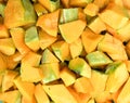 Orange long pumpkin cut into pieces Royalty Free Stock Photo