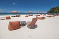 Orange lounge chairs and parasols at a luxury white sand beachfront resort in Dumaluan Beach, Panglao Island, Bohol, Philippines Royalty Free Stock Photo