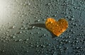 Orange lover heart on the raindrops background, Health Care