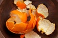 Orange mandarin peelings in wooden rustic bowl. Christmas holiday