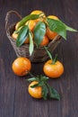 Orange mandarines heap in wicker basket