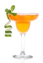 Orange Margarita cocktail with mint and lime spiral in chilled s Royalty Free Stock Photo