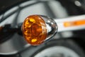 Orange marker bike light. Details of the motorcycle close-up.