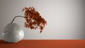 Orange mat table shelf with round marble vase and potted bonsai, coppery leaves, white background with copy space, zen concept