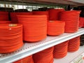 orange melamine plates on a shop shelf