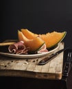 Orange melon with prosciutto