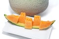 Orange Melon on a white plate. Royalty Free Stock Photo