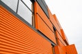 Orange metal building facade, bottom view Royalty Free Stock Photo