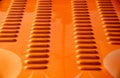 Orange metallic sport car surface background. Abstract details of a sport car engine cover.