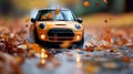 Orange Mini Cooper splashes through fall puddle Royalty Free Stock Photo