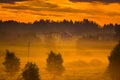 Orange misty sunrise at countryside Royalty Free Stock Photo