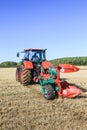 Kubota M7-173 ploughing on stubble in crop field