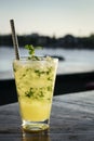 Orange mojito summer cocktail drink in outdoor riverside bar Royalty Free Stock Photo