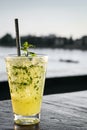 Orange mojito summer cocktail drink in outdoor riverside bar Royalty Free Stock Photo