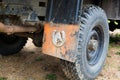 Orange mudflap with decoration attached to truck arch. Royalty Free Stock Photo