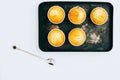 Orange muffins on a vintage metal tray