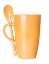 Orange mug with spoon empty blank for coffee or tea