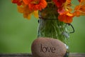 Love is the answer with fresh flowers Royalty Free Stock Photo