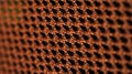 Orange net nylon fabric texture background for design. Royalty Free Stock Photo