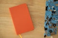 Orange notebook with blue plastic blocks