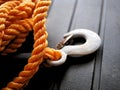 Orange nylon braided rope with metal tow hook. Royalty Free Stock Photo