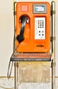 Orange Old Public telephone Royalty Free Stock Photo