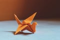 Orange origami bird , a bird made of paper-origami.