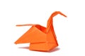 Orange origami swan over white