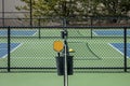 Orange Paddle and Yellow Ball at Pickleball Complex