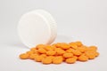 Orange Pain Killers and the lid of the package on white background