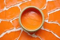 orange paint cracking on a clay pot
