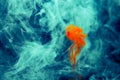 Red colored abstract drop cloud acrylic under water paint background yellow blue green orange cosmos black abstraction sky sea spa Royalty Free Stock Photo