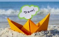 Orange Paper Boat on Sandy Seashore Close-up. Small Boat from Paper Royalty Free Stock Photo