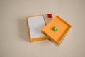 orange paper box with notepad and lid, bookbinding Royalty Free Stock Photo