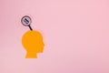 orange paper head with a cloud above, in it a sharpener, pink background and copy space Royalty Free Stock Photo