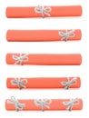 Orange paper scrolls tied with handmade ropes and bows isolated Royalty Free Stock Photo