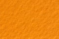 Orange paper texture background on macro. Plain backdrop. Royalty Free Stock Photo