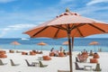 An orange parasol at the beachfront of a luxury resort in Dumaluan Beach, Panglao Island, Bohol, Philippines