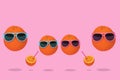 Orange party of fresh fruit, hipster in sunglasses with fresh orange juice, stylish fruit