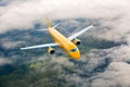 Orange passenger aircraft flies high above the clouds