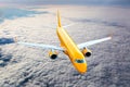 Orange passenger plane in flight.