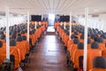 An orange passenger seat in a passenger boat
