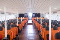 An orange passenger seat in a passenger boat