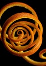 Orange Peel Spiral on Black Background Royalty Free Stock Photo