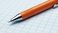 Orange Pen on Graph Paper Closeup Royalty Free Stock Photo